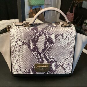 Kate Spade snakeskin and suede crossbody with fold over lock in gold hardware.